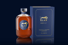 A bottle of ÉLAN Brandy V.S.O.P 38,8% 0.7L Limited Edition, reflecting süddeutsche Brennkunst, stands next to a blue and gold box featuring a leaping leopard and product details.